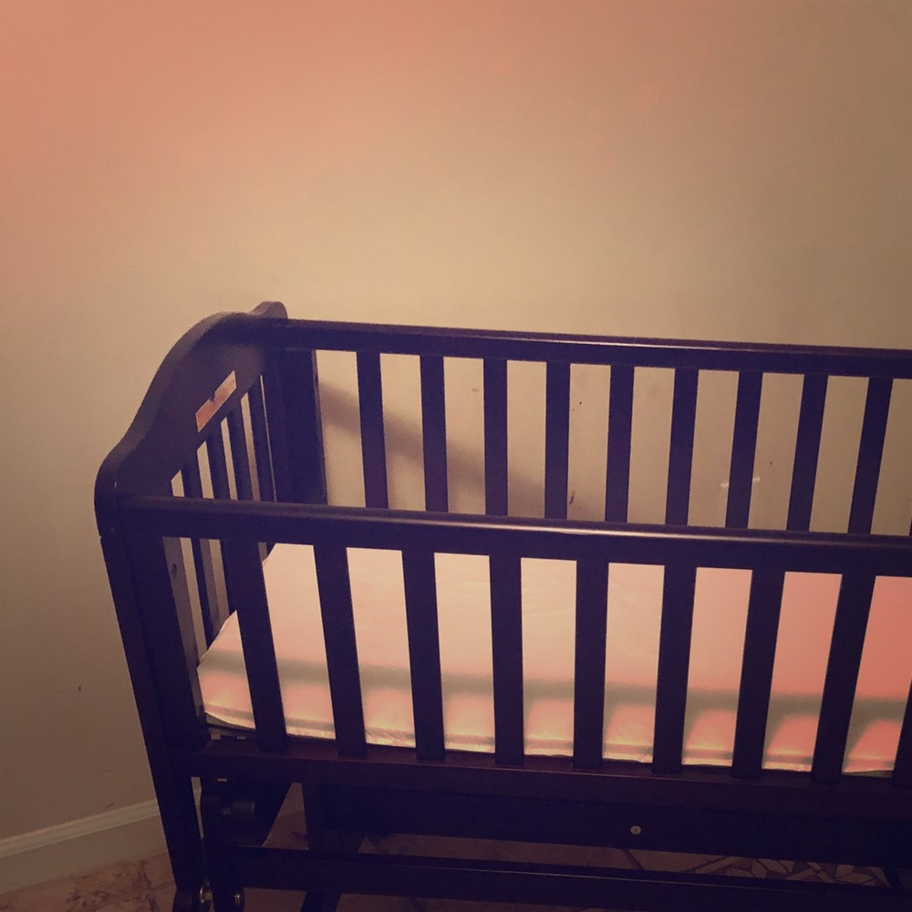 Dark cherry wood cradle. Gently used.